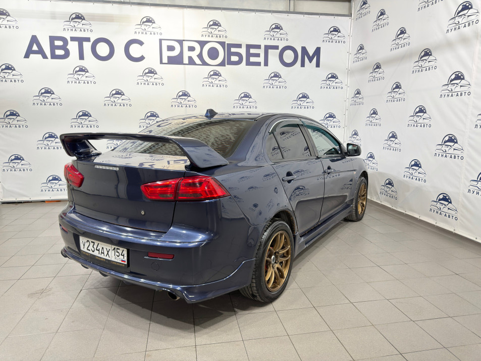 Автомобиль с пробегом Mitsubishi Lancer в городе Новосибирск ДЦ - PANGO Центр Луна